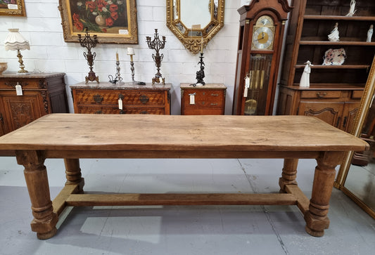 French Oak stretcher base farmhouse table with solid turned legs. It is in good original condition.