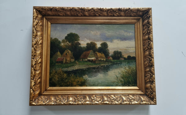 Lovely framed original oil on canvas of a country cottage scene on a river in good original condition