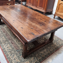 Impressive large size rustic French Oak coffee table with two drawers on a stretcher base. In good original detailed condition and sourced from France.