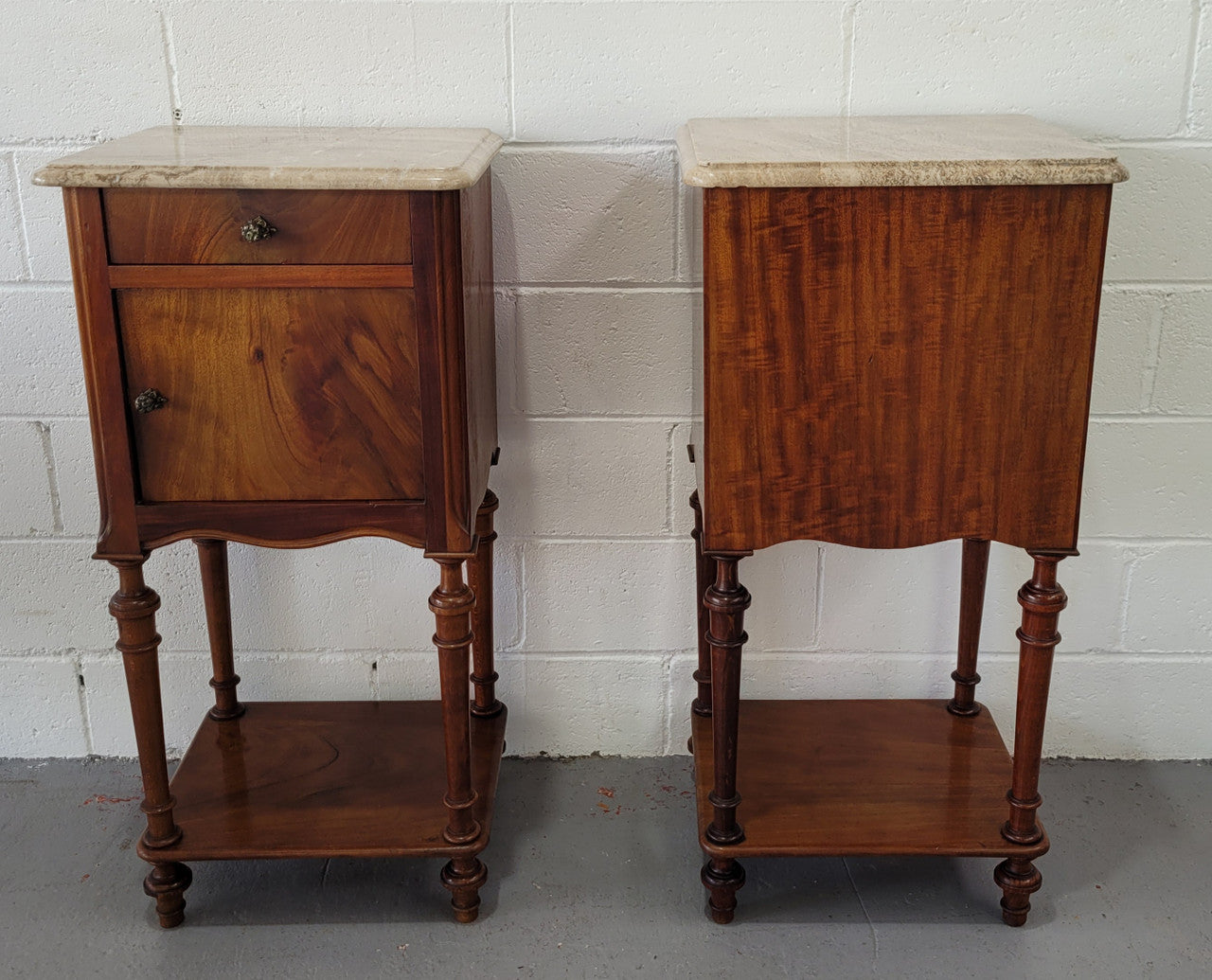 Pair of Louis XVI style walnut bedsides with attractive marble. They have one drawer, one cupboard and are in good original detailed condition.
