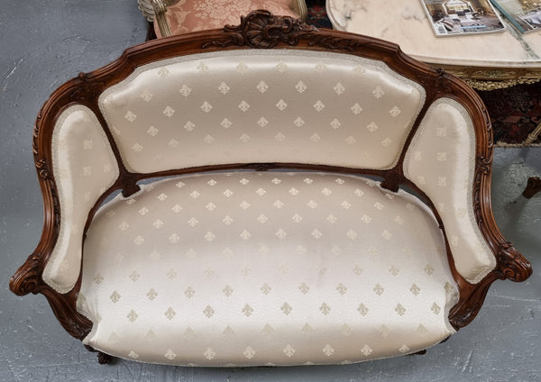 Pretty French Louis XV style small Walnut settee with very good upholstery. Sourced from France and in good original condition, please view photos of the upholstery as it helps form part of the description.