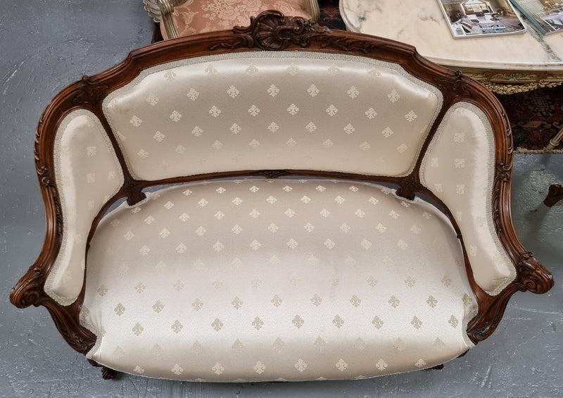 Pretty French Louis XV style small Walnut settee with very good upholstery. Sourced from France and in good original condition, please view photos of the upholstery as it helps form part of the description.