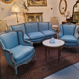Well Proportioned Louis XV Salon Suite consisting of well proportioned 3 seater down cushioned, winged settee with 2 matching bergere chairs. All upholstered in stunning blue self stripe fabric. In excellent condition. Circa: 1930's.