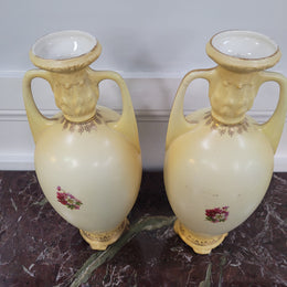 A beautiful pair of Edwardian Austrian hand-painted vases depicting a decorative flower scene. They are in good original condition with no chips or cracks. Please view photos as they help form part of the description.