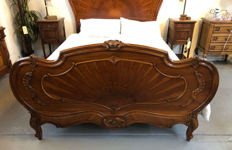 French queen size Walnut beautifully carved bed with inlay depicting the Sun . It has comes with steel rails and custom made slats all you need to do is put your mattress straight on top. In very good original detailed condition.