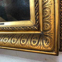 Sourced in France is this beautiful oil painting on canvas on a restored board of a lady and child. Framed in a thick decorative gilt frame. Signed and in good condition.