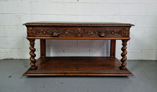 Antique French Oak Henry II style two drawer cabinet which would make an ideal TV cabinet or music unit. In good original detailed condition.