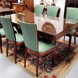 French Art Deco Figured Walnut dining table and six chairs. This stylish table also comes with a glass top and can be used with or without it. The chairs are very comfortable and the table can also fit another two chairs at either end making it a 6-8 seater. The table is in good original detailed condition with character marks to the top of table as shown in the pictures. This table and six chairs have been sourced locally.