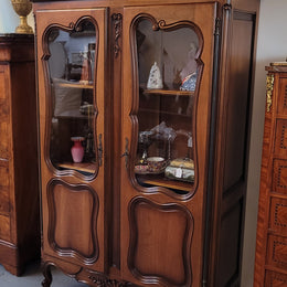 French Walnut Louis XV Style two half glass, door bookcase with three adjustable shelves. Sourced from France and in good original detailed condition.