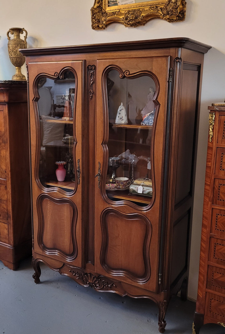 French Walnut Louis XV Style two half glass, door bookcase with three adjustable shelves. Sourced from France and in good original detailed condition.