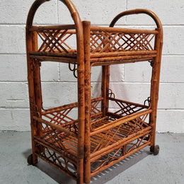 Excellent Vintage Tortoiseshell Bamboo two tier auto trolley. It has been sourced locally and is in fantastic original detailed condition .
