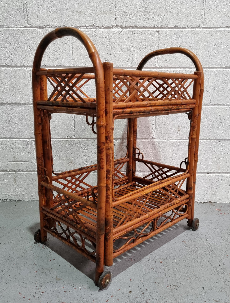 Excellent Vintage Tortoiseshell Bamboo two tier auto trolley. It has been sourced locally and is in fantastic original detailed condition .