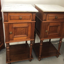 A lovely pair of French Oak, marble top bedside cabinets with a cupboard and drawer in good original condition.