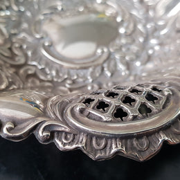 A Sheffield sterling silver bowl with repousse pattern, hallmarked WALKER & HALL and in good original condition.