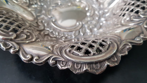 A Sheffield sterling silver bowl with repousse pattern, hallmarked WALKER & HALL and in good original condition.