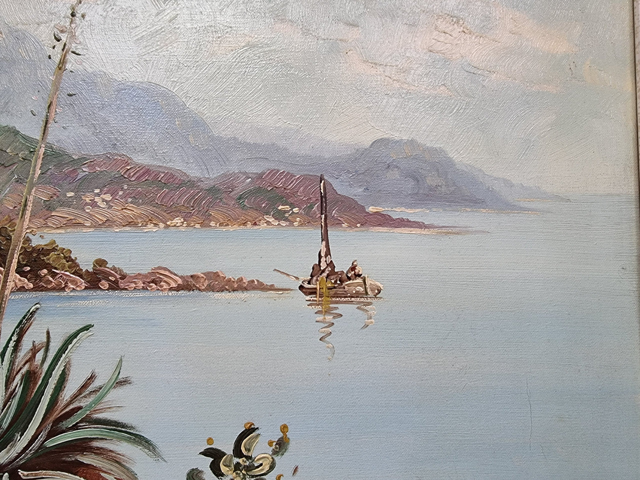 Sourced in France a colorful signed oil on canvas " Mediterranean coastal scene" in a decorative gilt frame. It is in good original detailed condition.