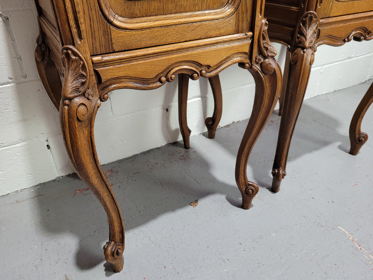 Pair of Louis XV style bedside cabinets with beautiful marble tops and one drawer and single cupboard for all your storage needs. In good original detailed condition.