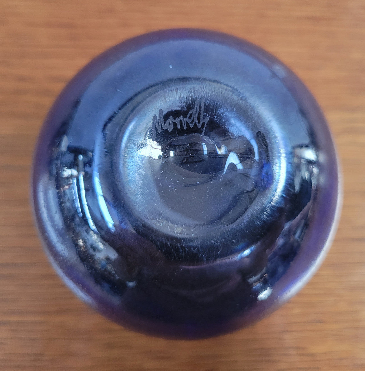 Stunning iridescent hand blown perfume bottle. Beautiful peacock blue, purple colours. Signed on base with clear glass stopper.