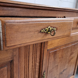 French Oak Early 19th Century sideboard with two doors and three drawers. In good original condition.