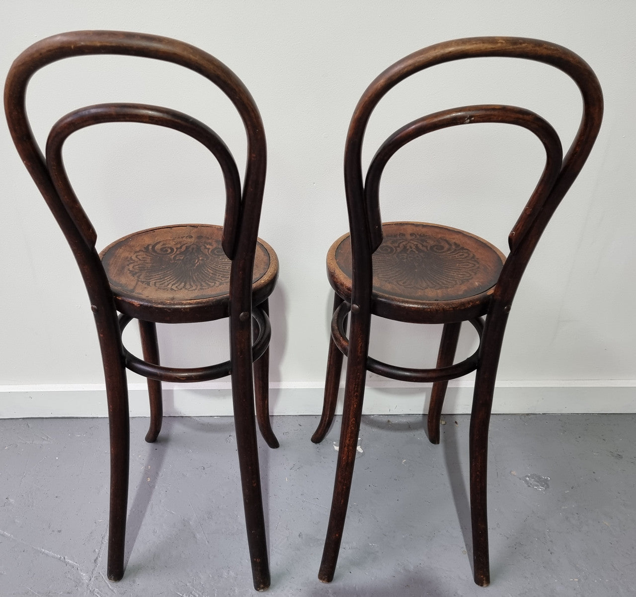 Rare petite cafe Bentwood chairs with original shell embossed seats. They are in very good original condition. They would make great addition to your breakfast bar.