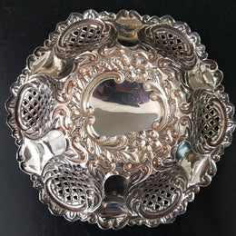 A Sheffield sterling silver bowl with repousse pattern, hallmarked WALKER & HALL and in good original condition.