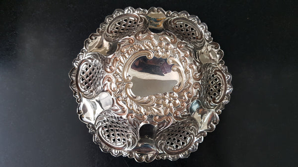 A Sheffield sterling silver bowl with repousse pattern, hallmarked WALKER & HALL and in good original condition.
