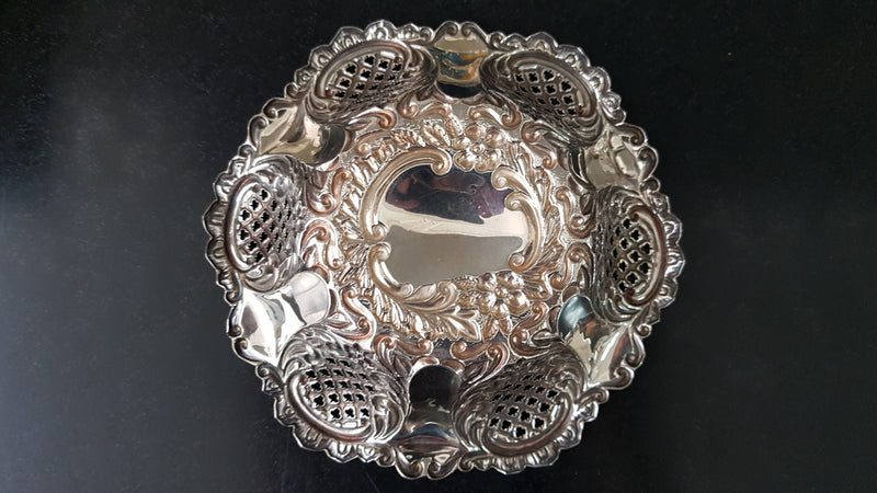 A Sheffield sterling silver bowl with repousse pattern, hallmarked WALKER & HALL and in good original condition.