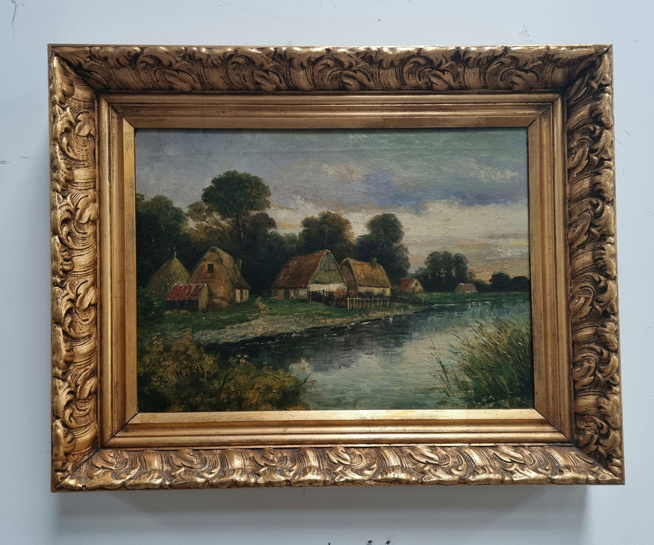 Lovely framed original oil on canvas of a country cottage scene on a river in good original condition