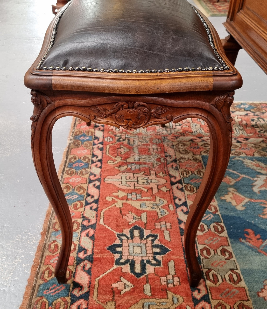 Impressive French Louis 15th style walnut upholstered duet leather stool. Very Good Condition.  Circa: 1930’s, sourced in France.