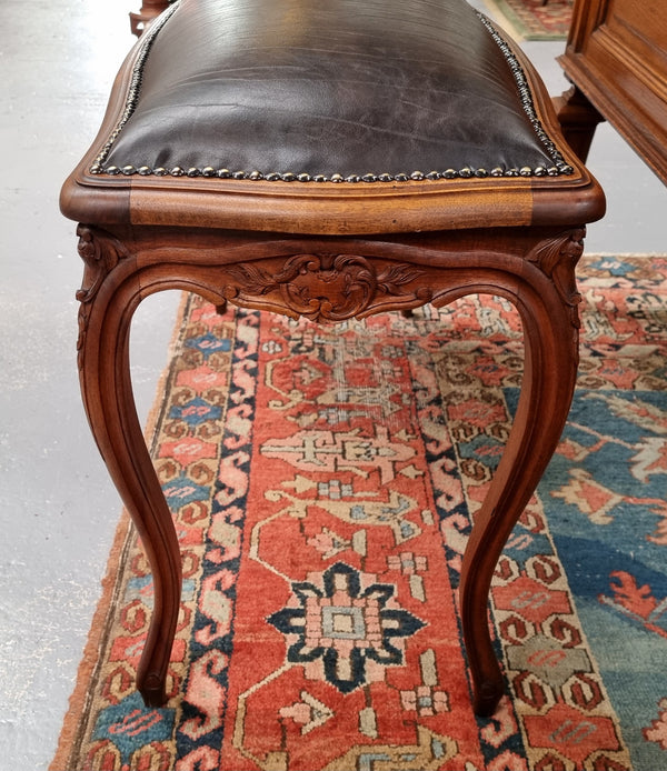 Impressive French Louis 15th style walnut upholstered duet leather stool. Very Good Condition.  Circa: 1930’s, sourced in France.