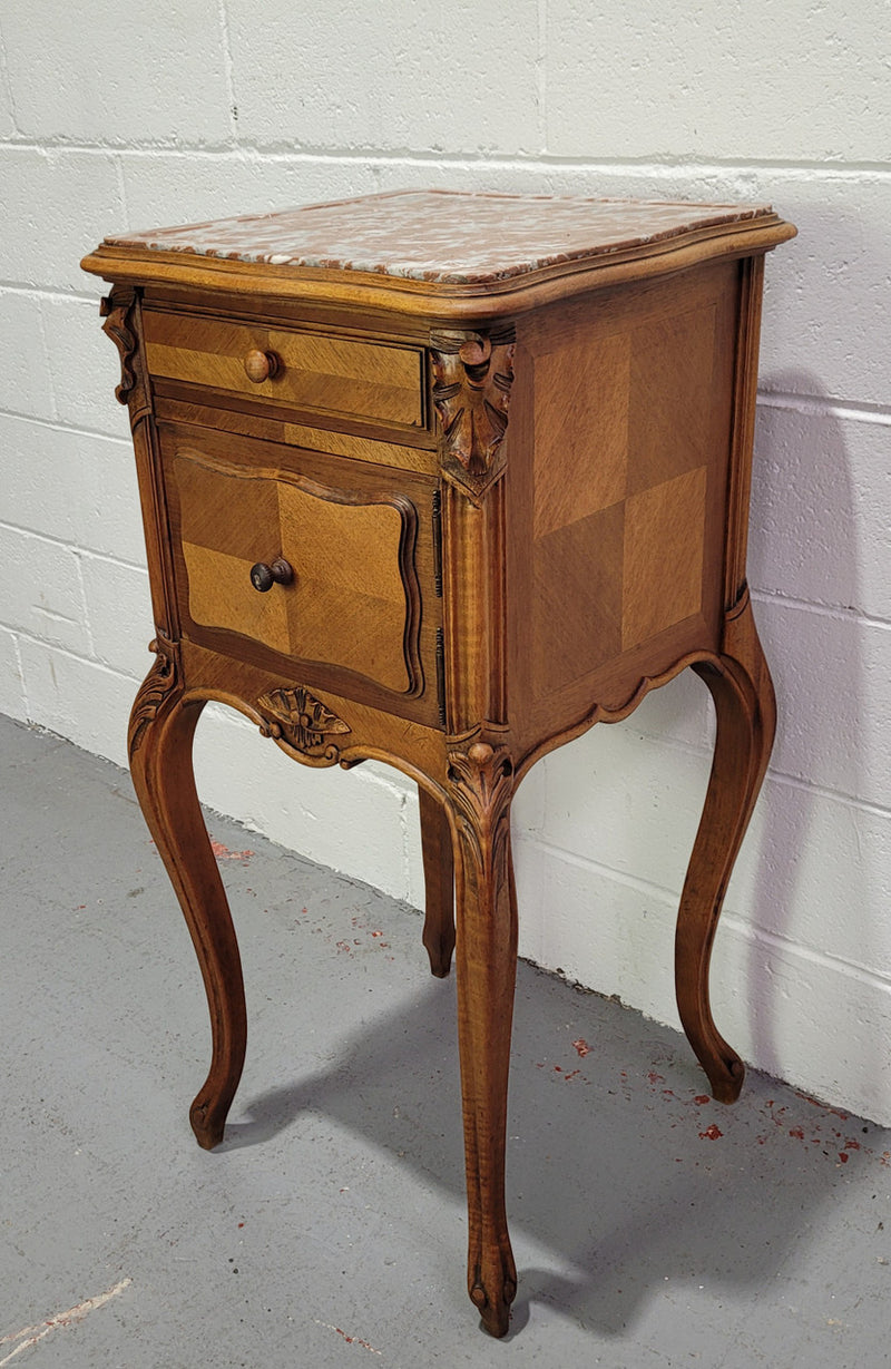 Single French Louis XV style Walnut inset marble top bedside. It has one drawer and one cupboard. It is in good original detailed condition.