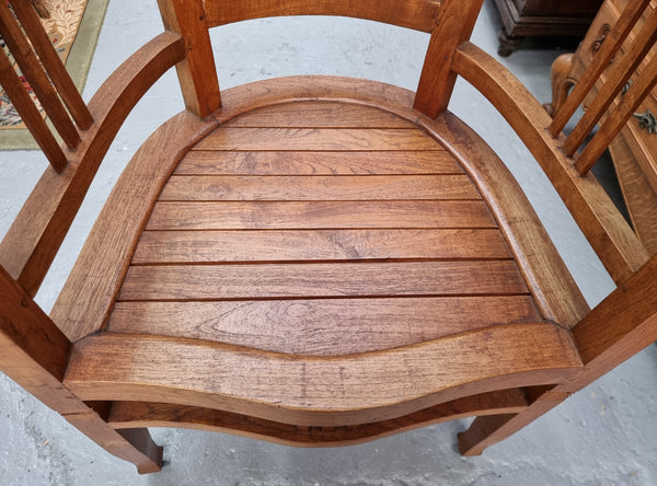 Vintage teak "Captains Chair". It is well built and very comfortable to sit in. It is in good original detailed condition.