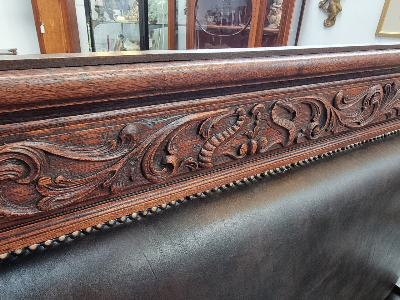 Superbly carved early 19th century newly upholstered French Oak hall seat of grand proportions and lovely details in good condition.