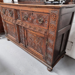Impressively carved 18th Century English Oak kitchen dresser in 17th Century Jacobean style. It is in good original detailed condition and has been sourced from France.
