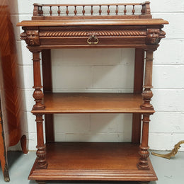 A French 19th century oak carved three tier cabinet. The cabinet/dumbwaiter has carved half border top that can be removed. Drawer for storage and in very good original condition.
