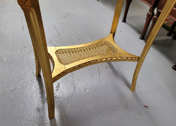 Impressive French oval Louis XVI style gilt and white marble topped two tier lamp/side table. It has been sourced from France and is in good original detailed condition.