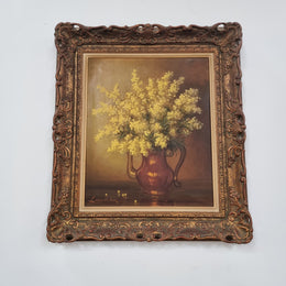 French floral still life painting oil on canvas of Wattle in a vase in a stunning decorative frame in good condition. Signed by artist and has been sourced from France.
