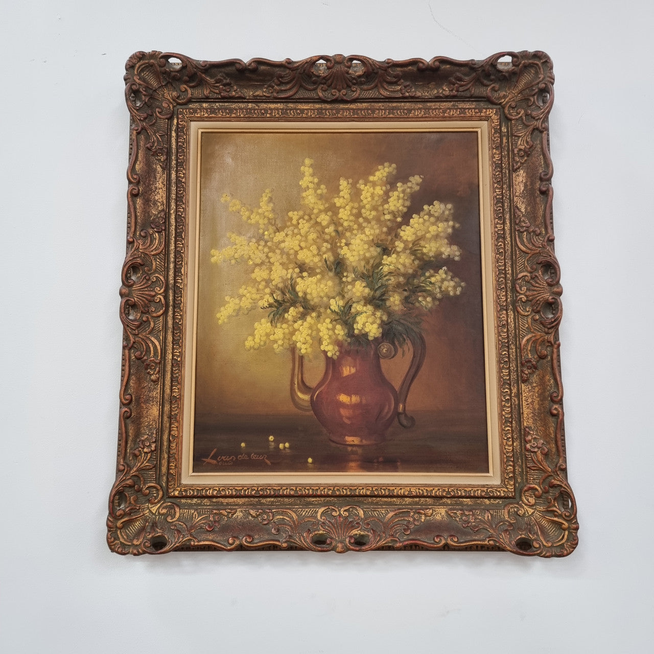 French floral still life painting oil on canvas of Wattle in a vase in a stunning decorative frame in good condition. Signed by artist and has been sourced from France.