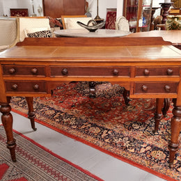 Lovely Victorian Cedar leather tooled  top desk, with five drawers on castors and of pleasing proportions. In very good original detailed condition and has been sourced locally.