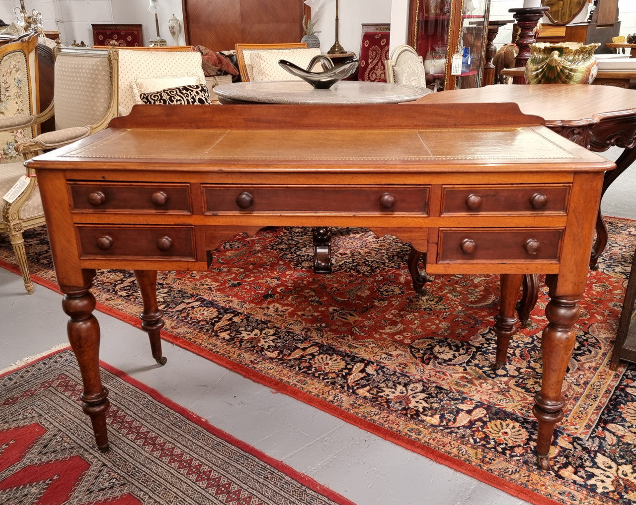 Lovely Victorian Cedar leather tooled  top desk, with five drawers on castors and of pleasing proportions. In very good original detailed condition and has been sourced locally.