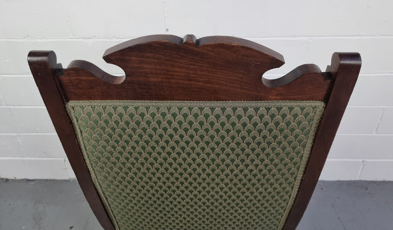 Pair of Edwardian button back Walnut armchairs. They are in good original condition with clean upholstery.