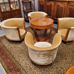 Four stunning original Art Deco Tulip shaped salon lounge chairs made specifically for the Hotel Le Malandre, Belgium  in the 1930’s. They are marked with a metal tag “Hotel Le Malandre Modele Depose”  Burl Walnut, Walnut and gold coloured velvet upholstery and rest on a thick wooden circular base it has been sourced in France and in good original condition. Included in the set is the accompanying Art Deco Walnut with glass top side table also made for Hotel Le Malandre and marked with the metal tag.  Absol