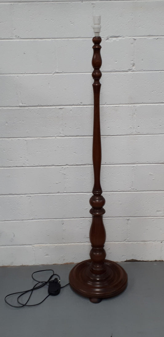 Antique Walnut standard lamp, with foot switch and in good working order condition.