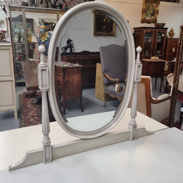 French Louis XVI style painted dresser / console with beveled oval mirror and three drawers. Sourced from France and in good original detailed condition.