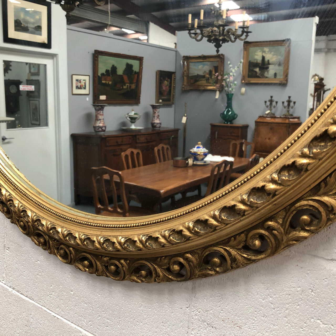 Decorative round gilt wall mirror.