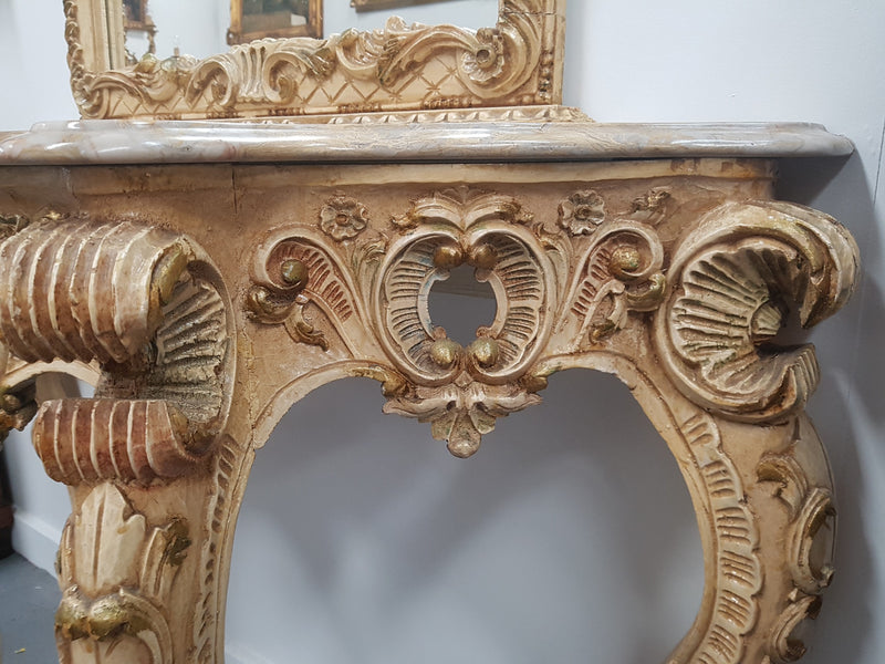 Beautifully carved Italian Rococo style painted console/hall table and mirror. An amazing coloured marble top showing sections of gold veins and is in good condition. Mantle mirror is retaining it's original mirror and showing ages spots.