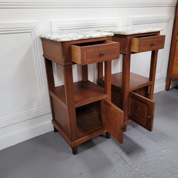 Pair of Antique French Oak Louis XVI style marble top bedside cabinets. They have decorative inlay and have been sourced from France. They are in good original detailed condition.
