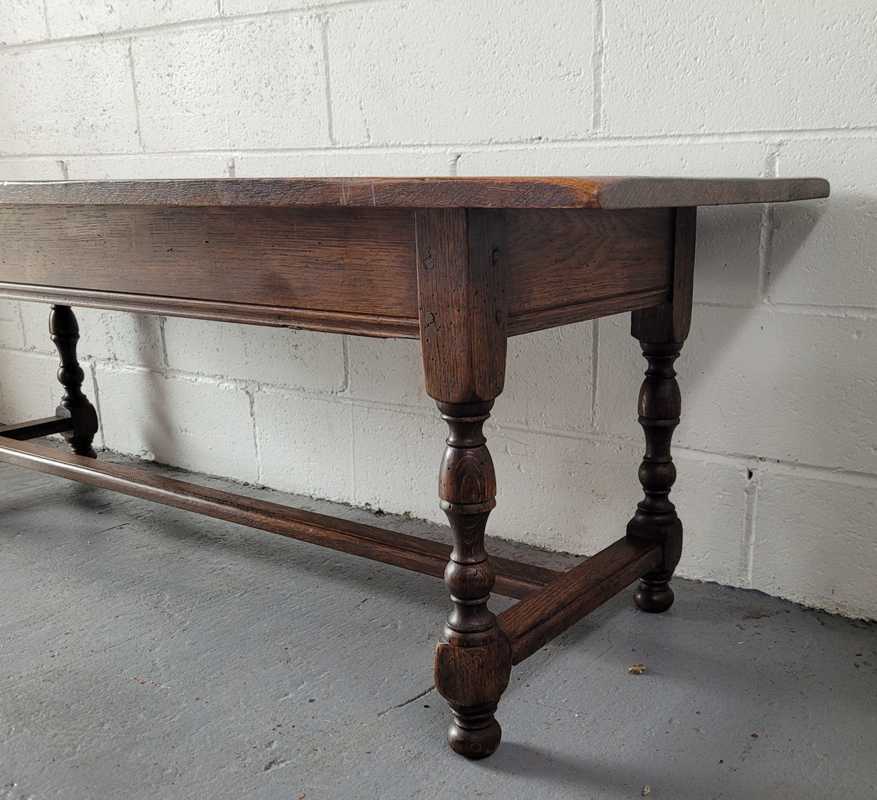 Rustic French Oak pedestal base coffee table. It is in good original detailed condition.