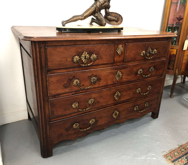Stunning French 18th Century Walnut commode with beautiful hardware. In good original detailed condition.