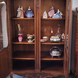 French Walnut Louis XV Style two half glass, door bookcase with three adjustable shelves. Sourced from France and in good original detailed condition.
